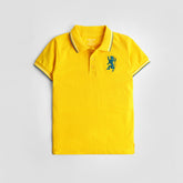 A lemon yellow color boys' short sleeve polo t-shirt with a collar and a decorative element on the chest.